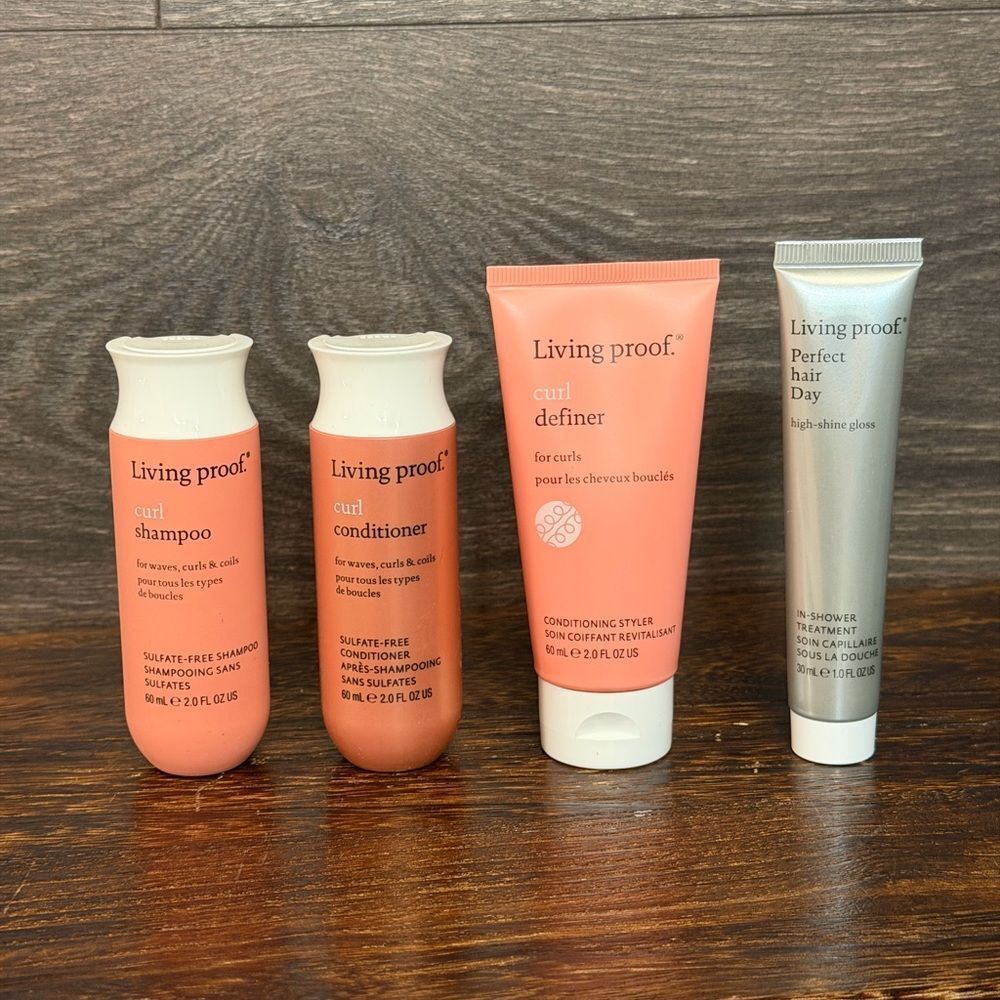 Living Proof Curly Hair Essentials travel-size set, four mini products plus bag